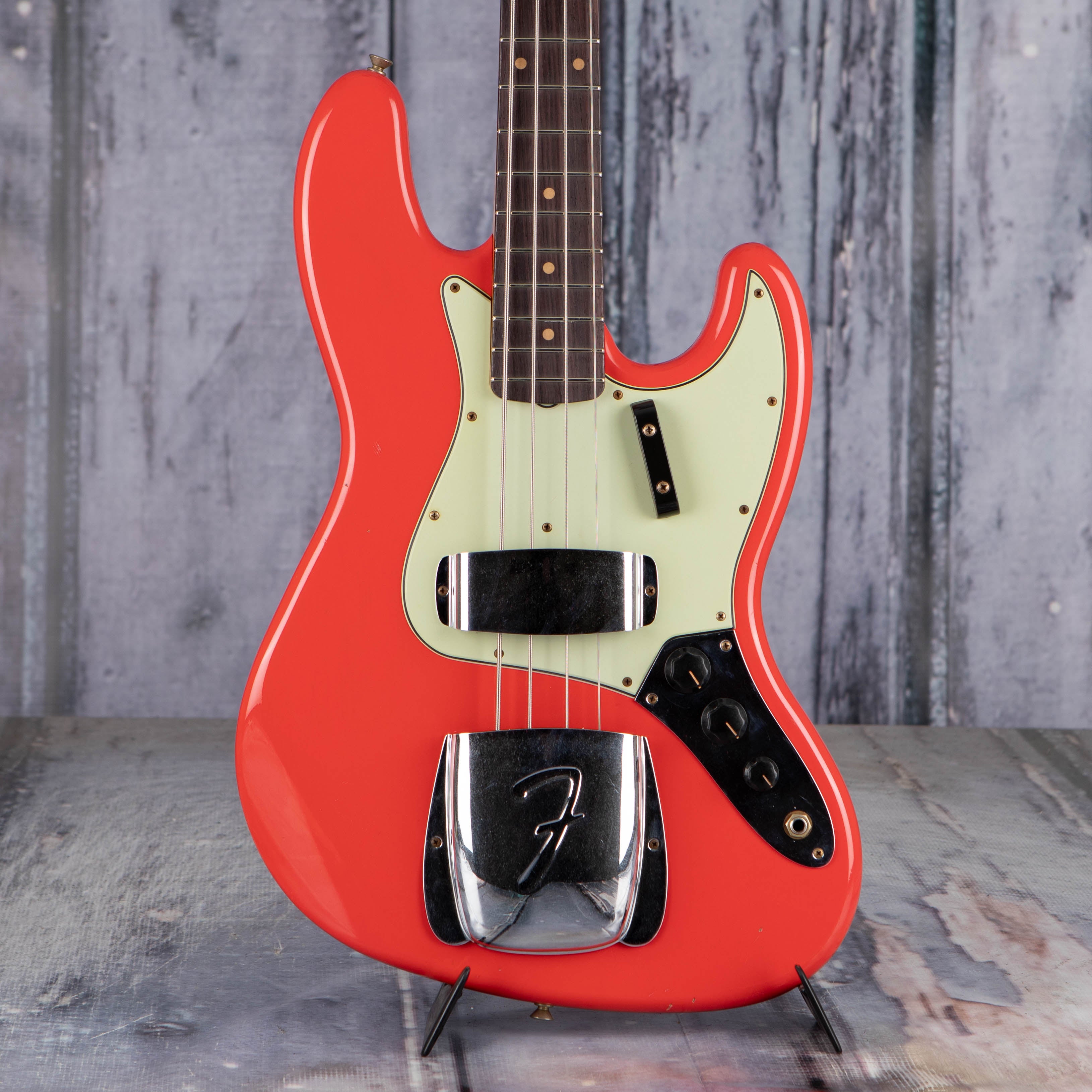 Fender Custom Shop Limited 1964 Jazz Bass Journeyman Relic Electric Bass Guitar, Aged Fiesta Red, front closeup